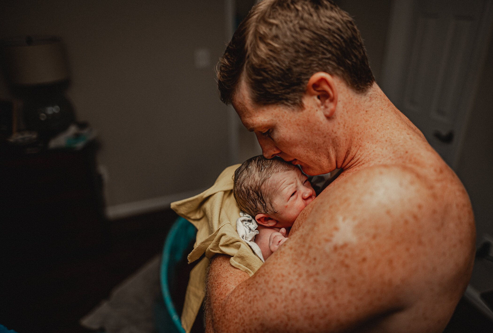 First skin-to-skin time with dad after a hime water birth with premier Birth Center midwives during COVD pandemic