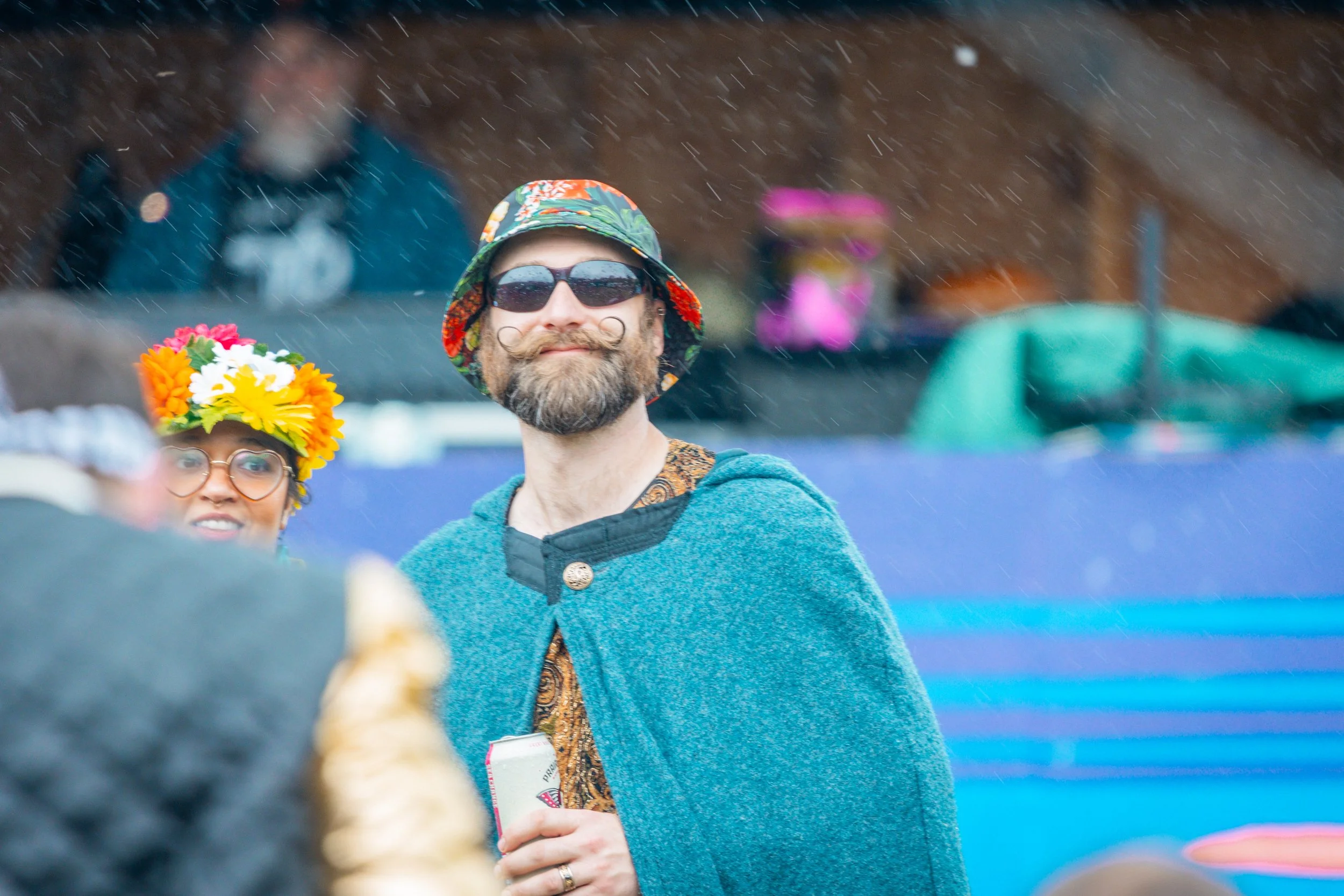 Audience in the rain Mustache 6-4365.jpg