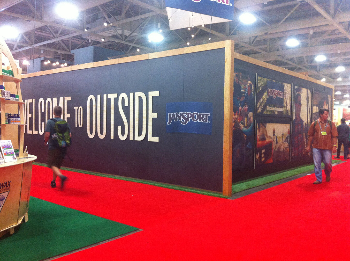 Exterior booth graphics with flood coat and pop-off graphics.