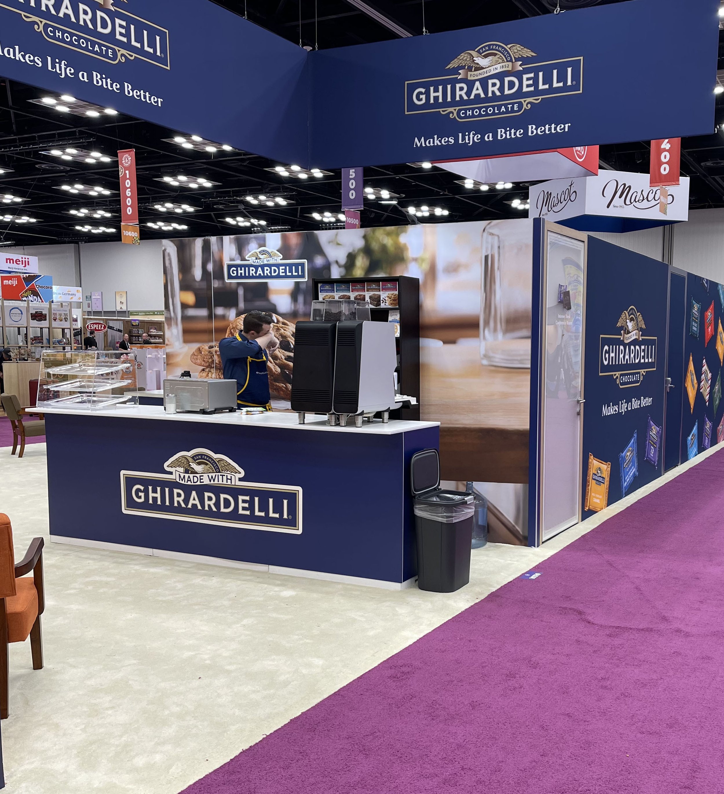 Sweets & Snacks Expo 2024 - Annual tradeshow for the sweets & snacks industry. Multiple areas of interest including an interactive hot cocoa bar and smores creation space, seating areas, meeting rooms and product highlight zones.