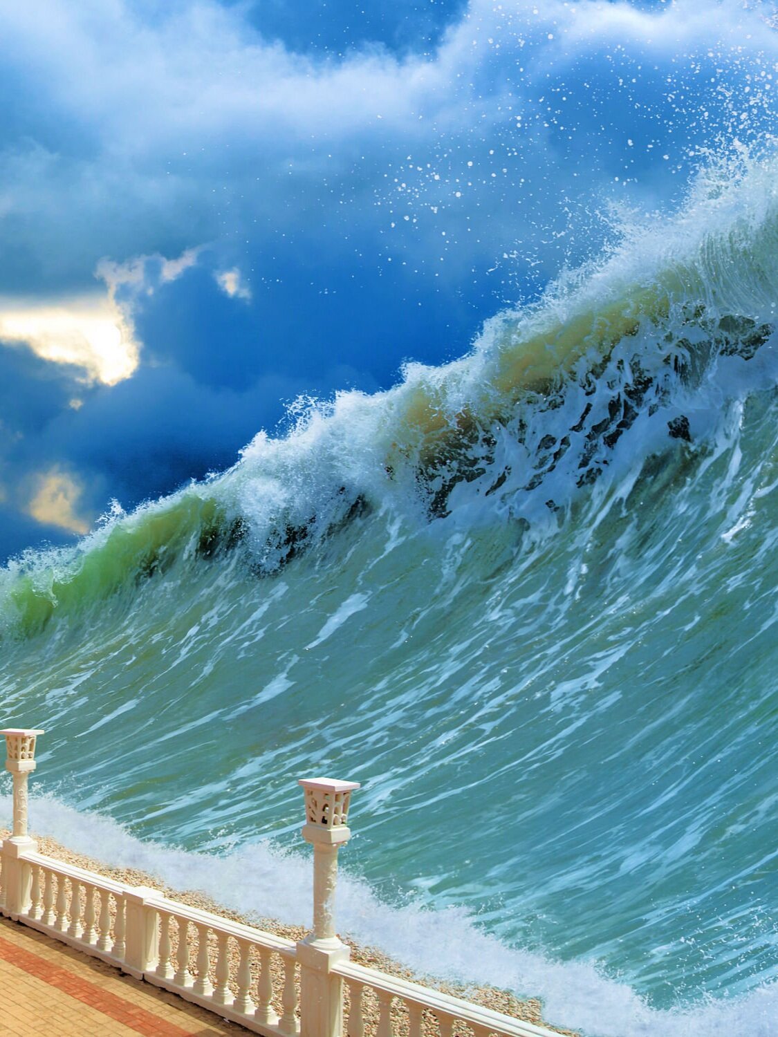 Tsunami – A series of waves in a water body caused by the displacement of a large volume of water; an arrival or occurrence of something in overwhelming quantities or amounts