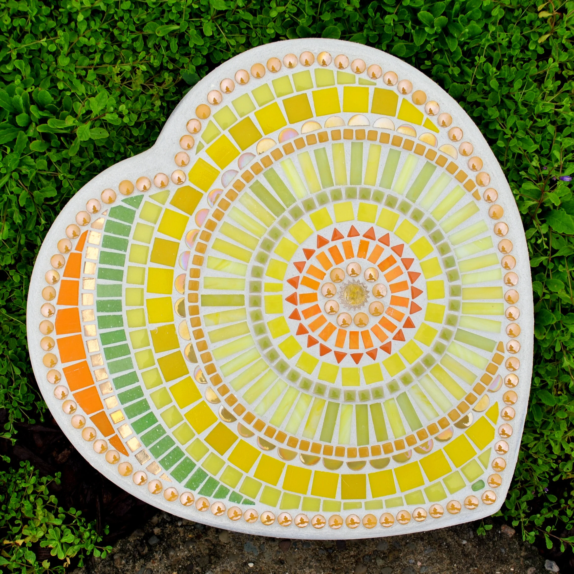 Sunshine yellow marigold and orange mosaic garden stepping stone