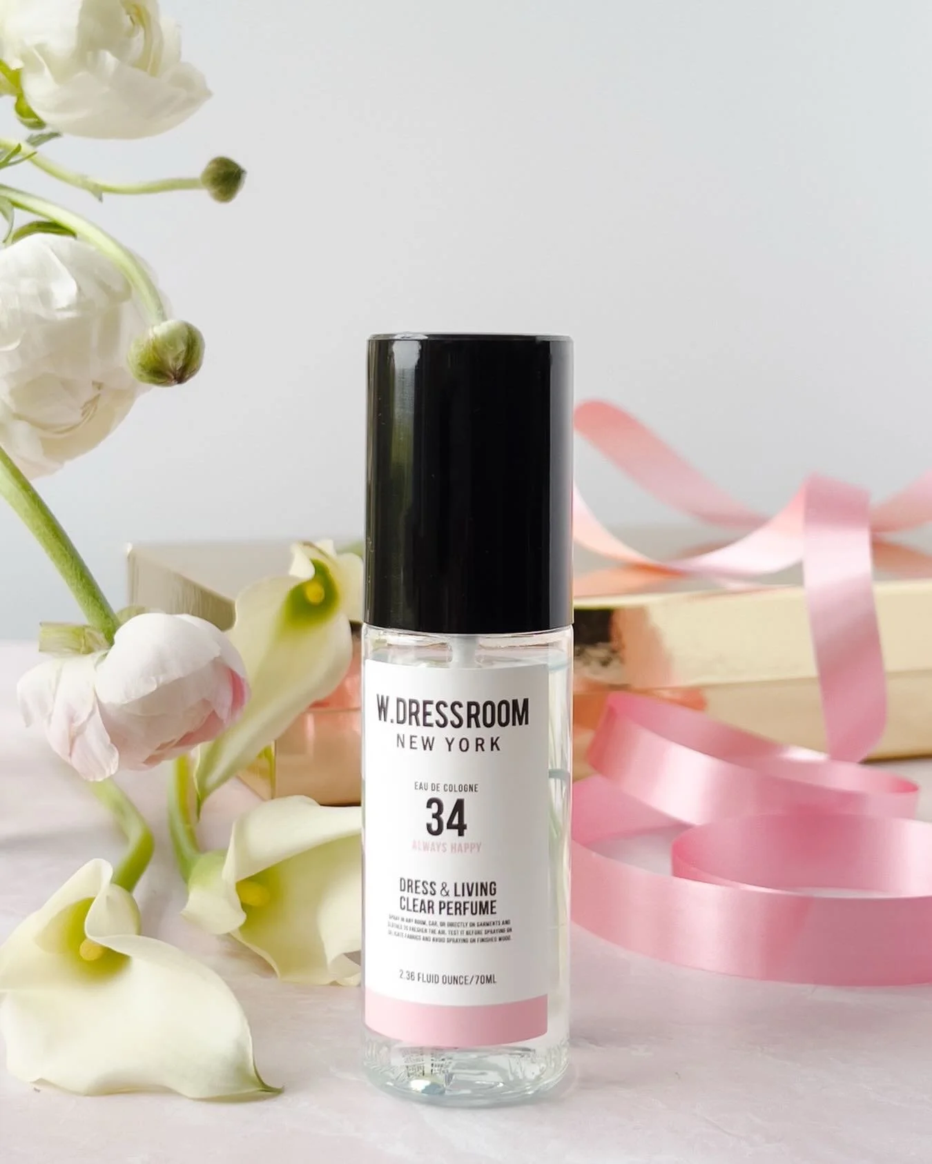 A composition built on balance.

Vertical structure softened by organic movement.
The depth of the glass contrasted with airy florals.
Matte ribbon echoing the blush tones of the label.
Negative space allowing the eye to rest exactly where it should.