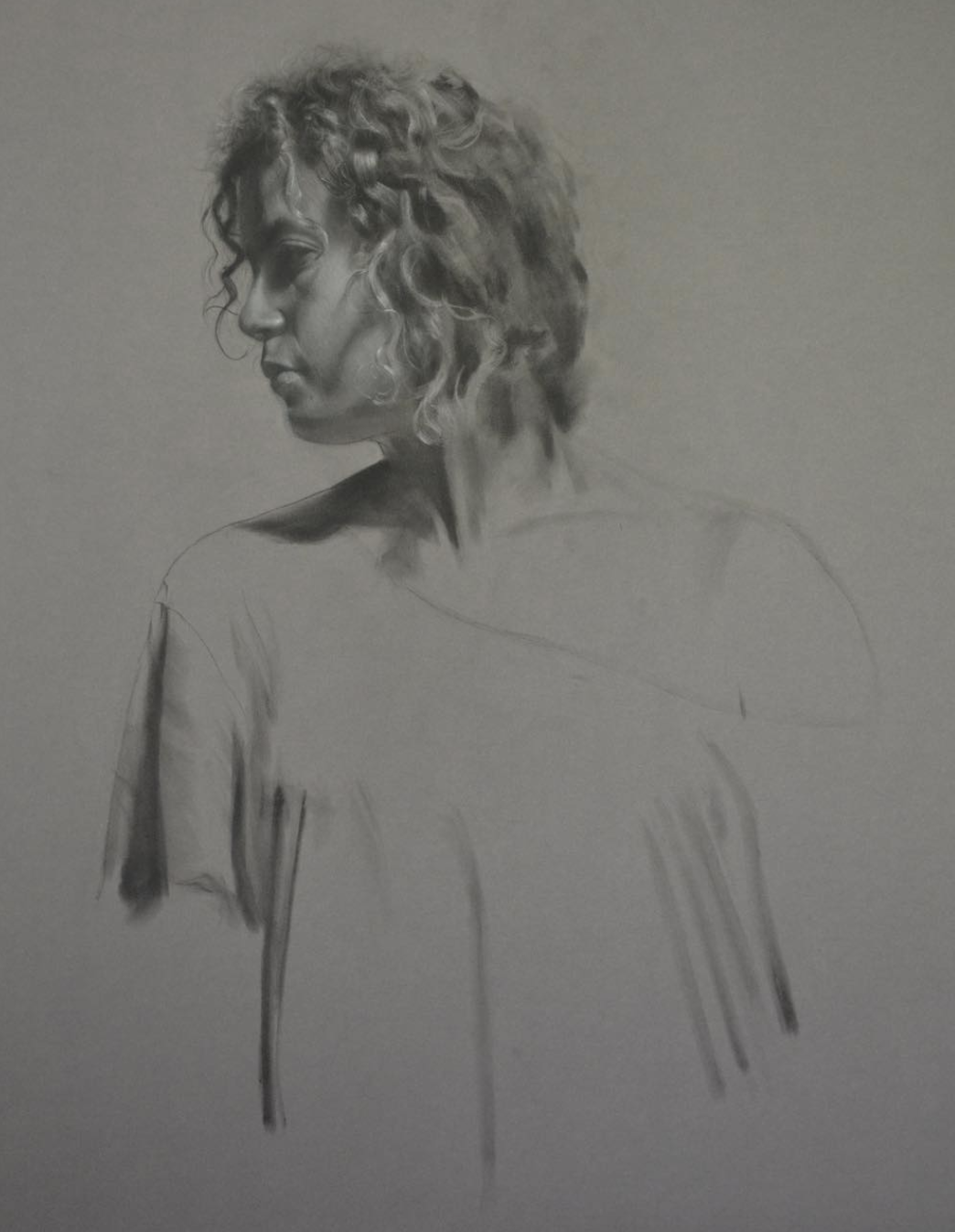 Charcoal, white chalk, pan pastel realism drawing of a woman. Brian Parrillo art, fine art, tattoo artist in Durham North Carolina at Ethereal Tattoo Gallery. On display in Durham, North Carolina.