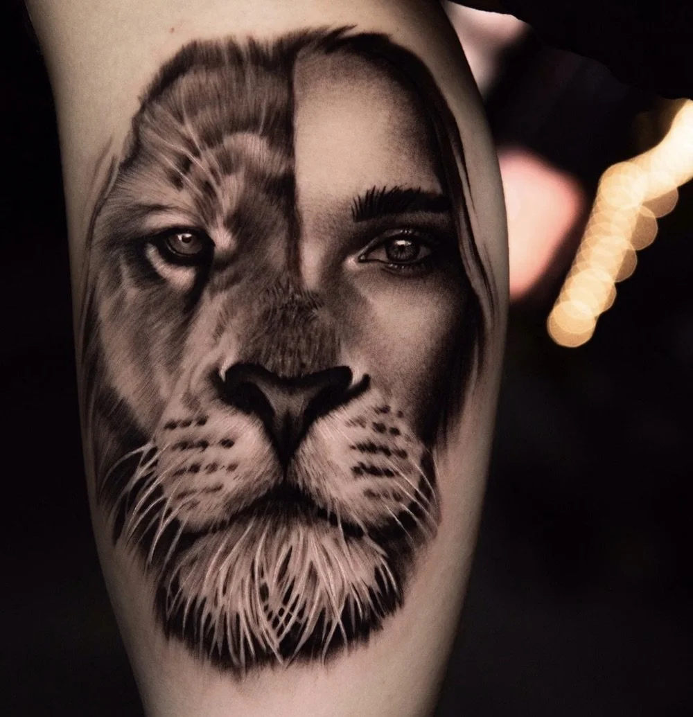 Black and grey realism split-face tattoo merging a lion and human portrait with detailed eye work by Brian Parrillo Durham NC