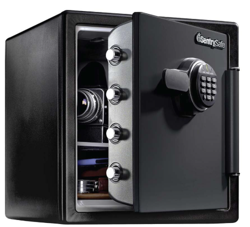 A black SentrySafe fireproof safe with a digital keypad lock, partially open showing camera and valuables inside.