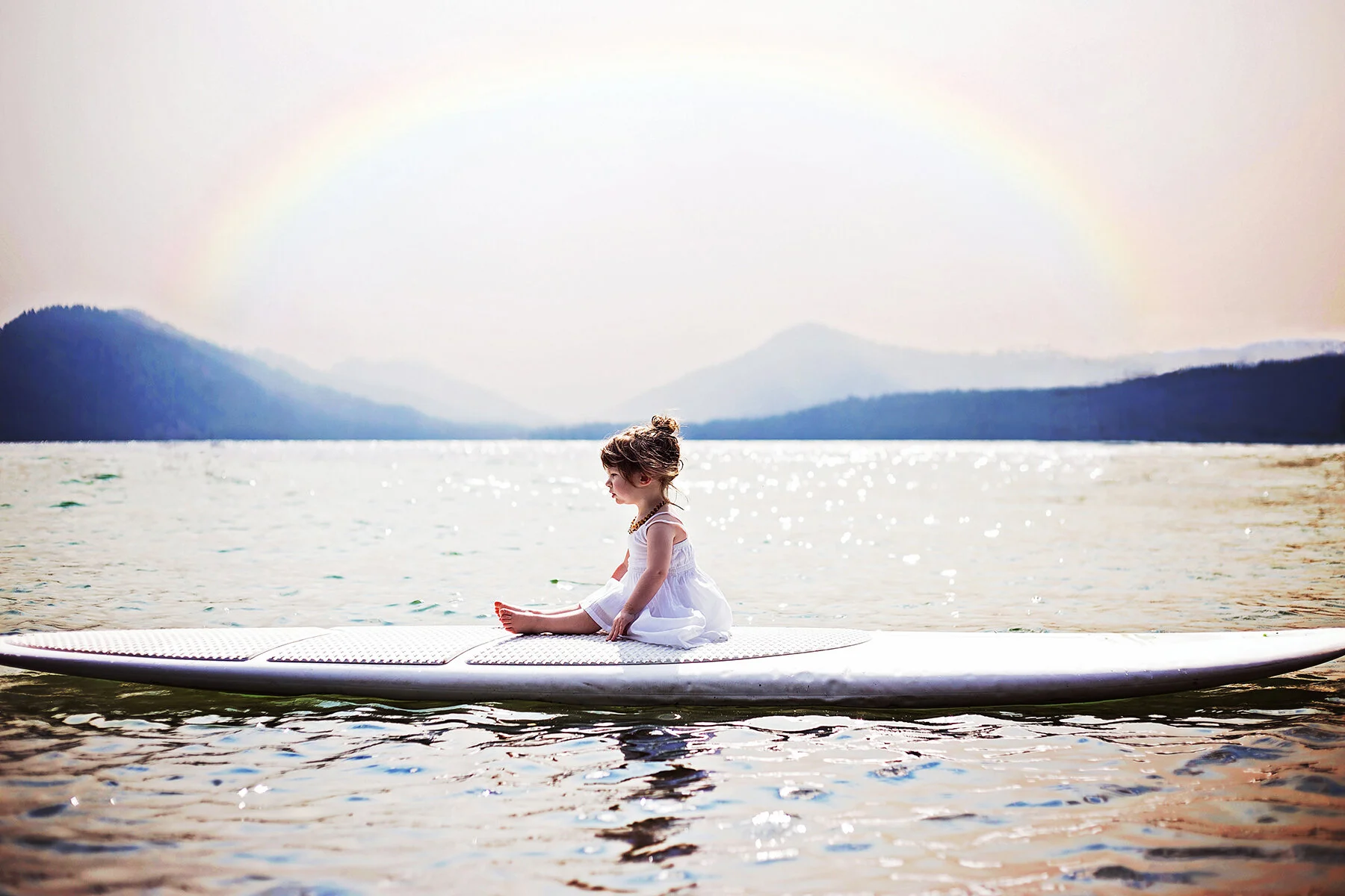 little-girl-rainbow-on-lake.jpg