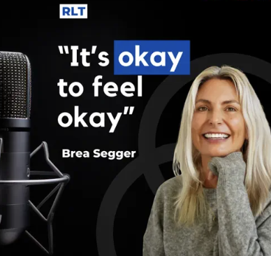 A woman smiling in front of a black background with a microphone and a quote that reads, 'It's okay to feel okay' by Brea Segger.