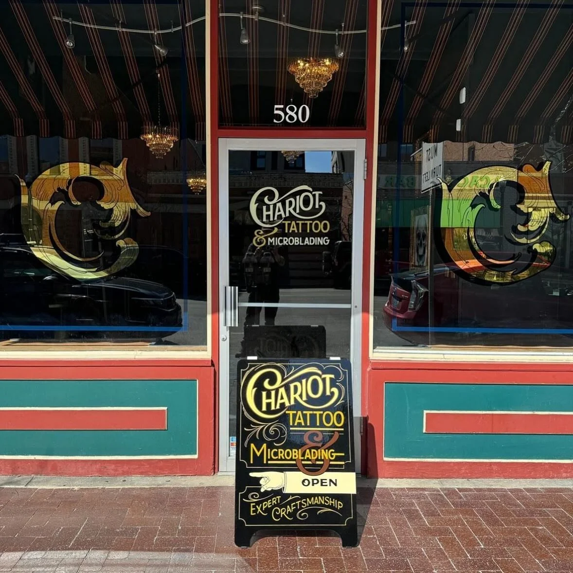 Windows &amp; A-Frame design and painting for @chariot.tattoo in Boise, Idaho ✨✨

#RockyRoadStudios #GoldLeaf #Signpainting #Lettering