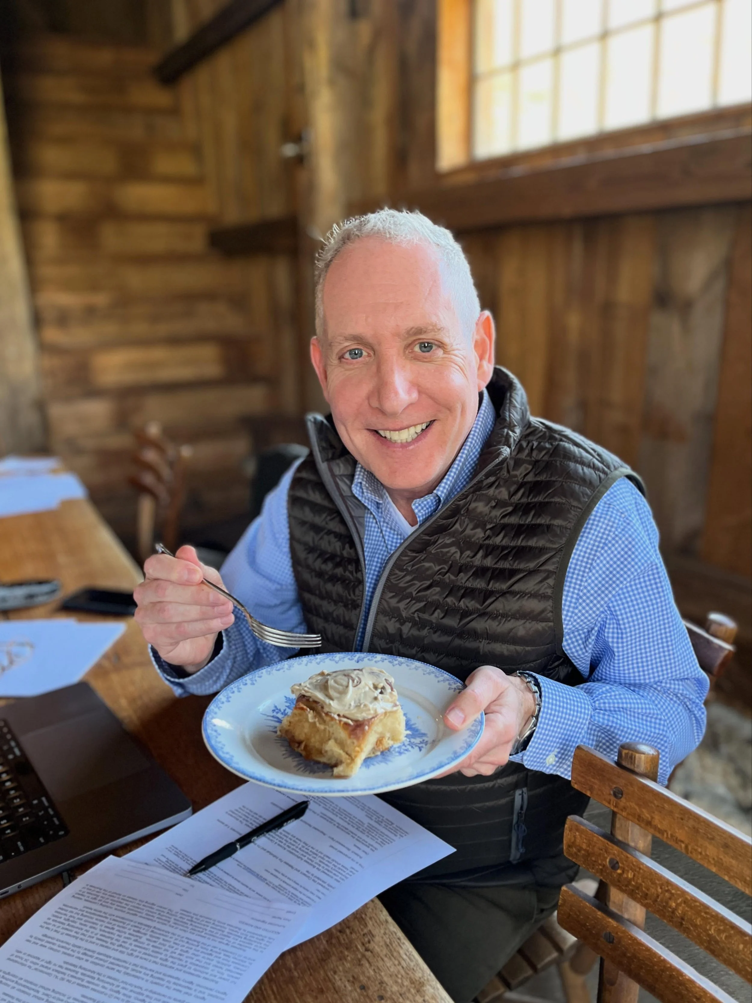 O cinnamon roll, glorious spiral of chaos and comfort,
you are the reason &ldquo;I&rsquo;ll just have half&rdquo; has never once worked out.

You show up warm, dramatic, heavily frosted, and fully committed to improving everyone&rsquo;s mood.
Fundrai