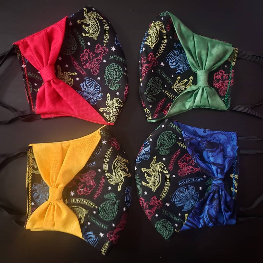 Hogwarts House Pride Masks | 
Show off your house pride with the first of many of my specialty mask designs. The interior fabric and outer bow match the 4 house colors. As part of my grand opening special get this mask and a matching scrunchie for on