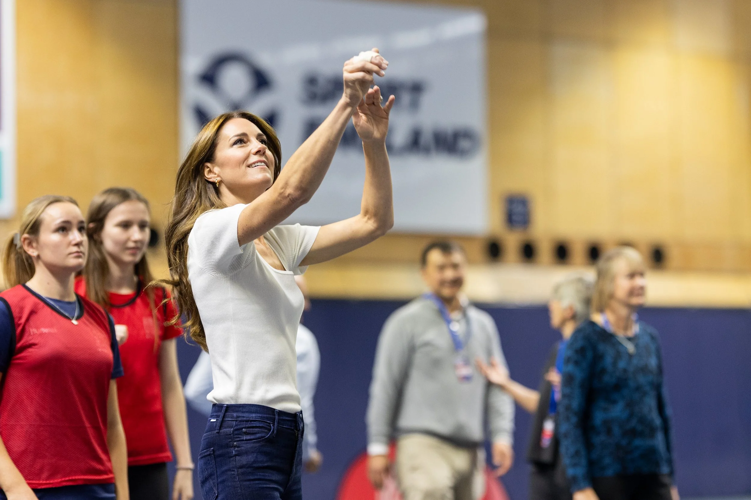 Her Royal Highness The Princess of Wales shoots at goal while she participates in a netball game.