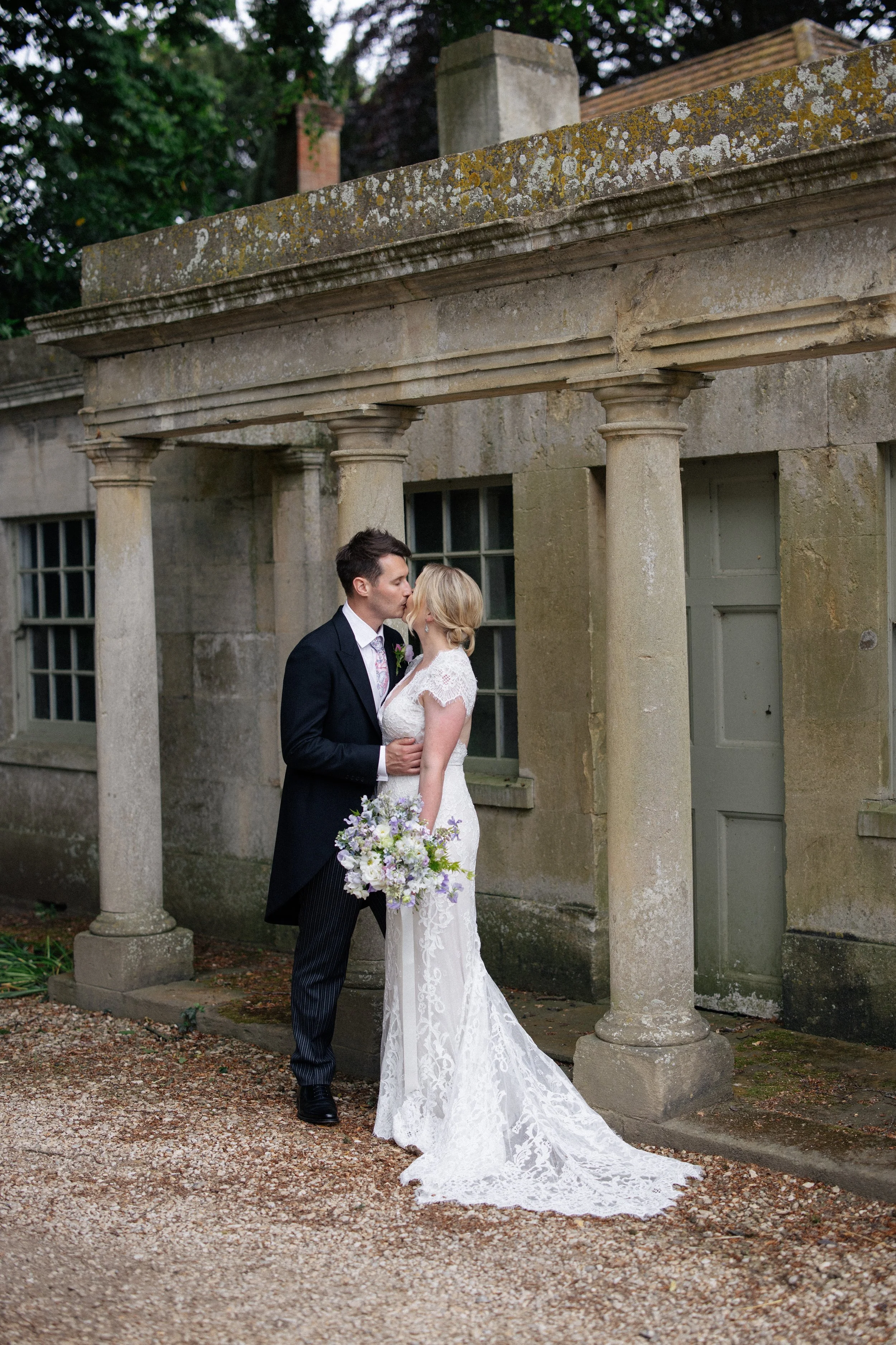 A bride and groom kiss at their wedding in Shropshire