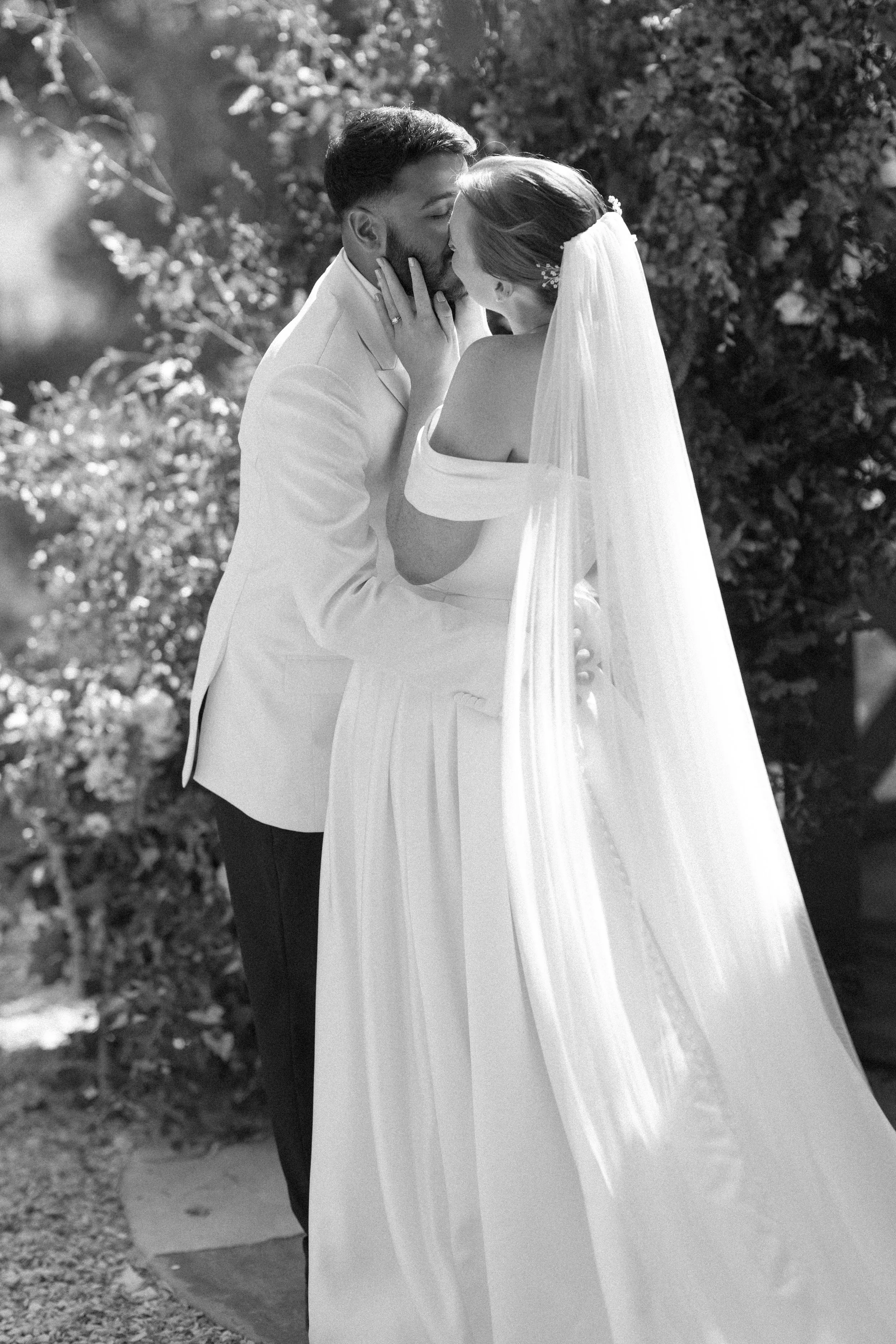 A bride and groom share their first kiss at their wedding at Crockwell Farm