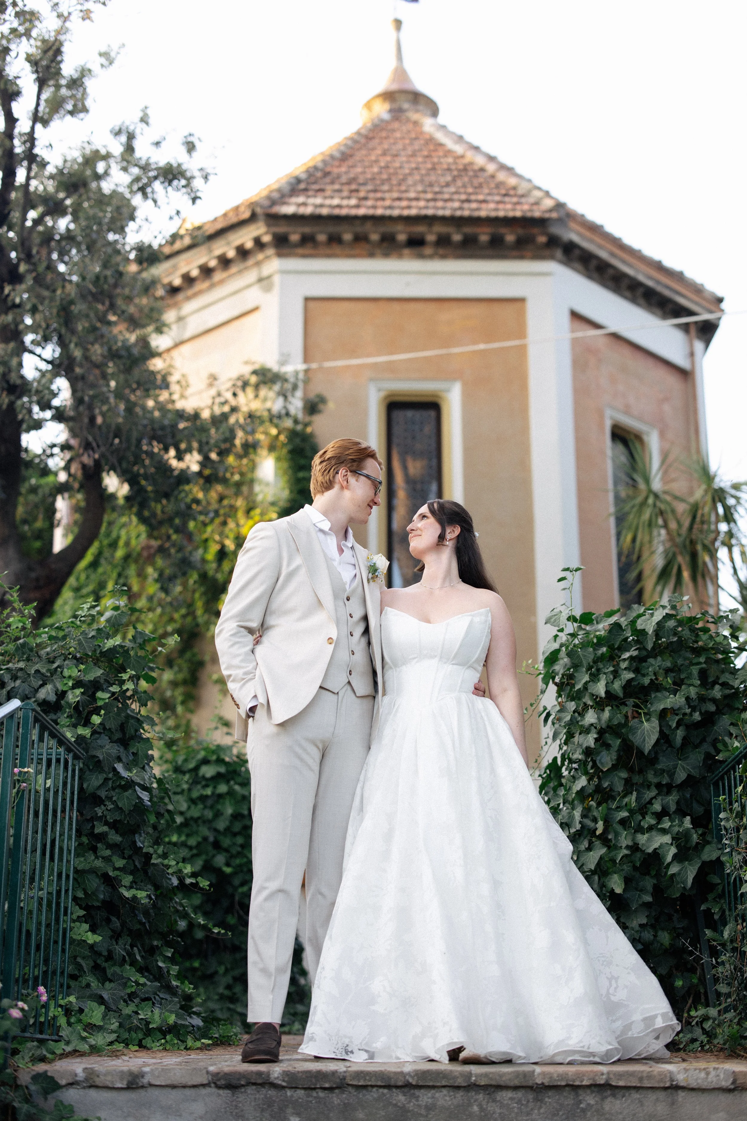A bride and groom look lovingly at each other at Villa Giulia in Fano, Italy