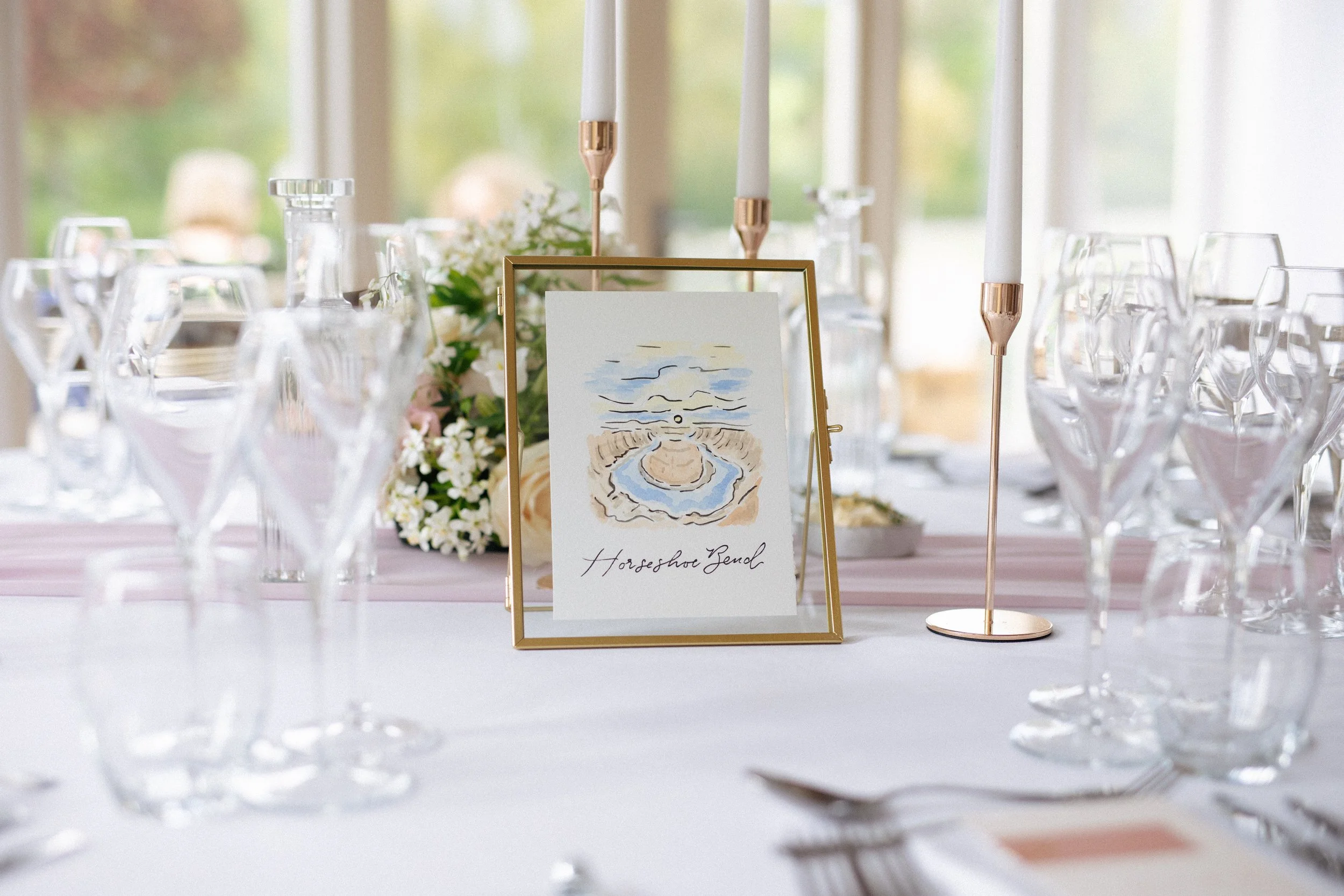 Beautiful table names in the centre of a table at a wedding at Hyde House