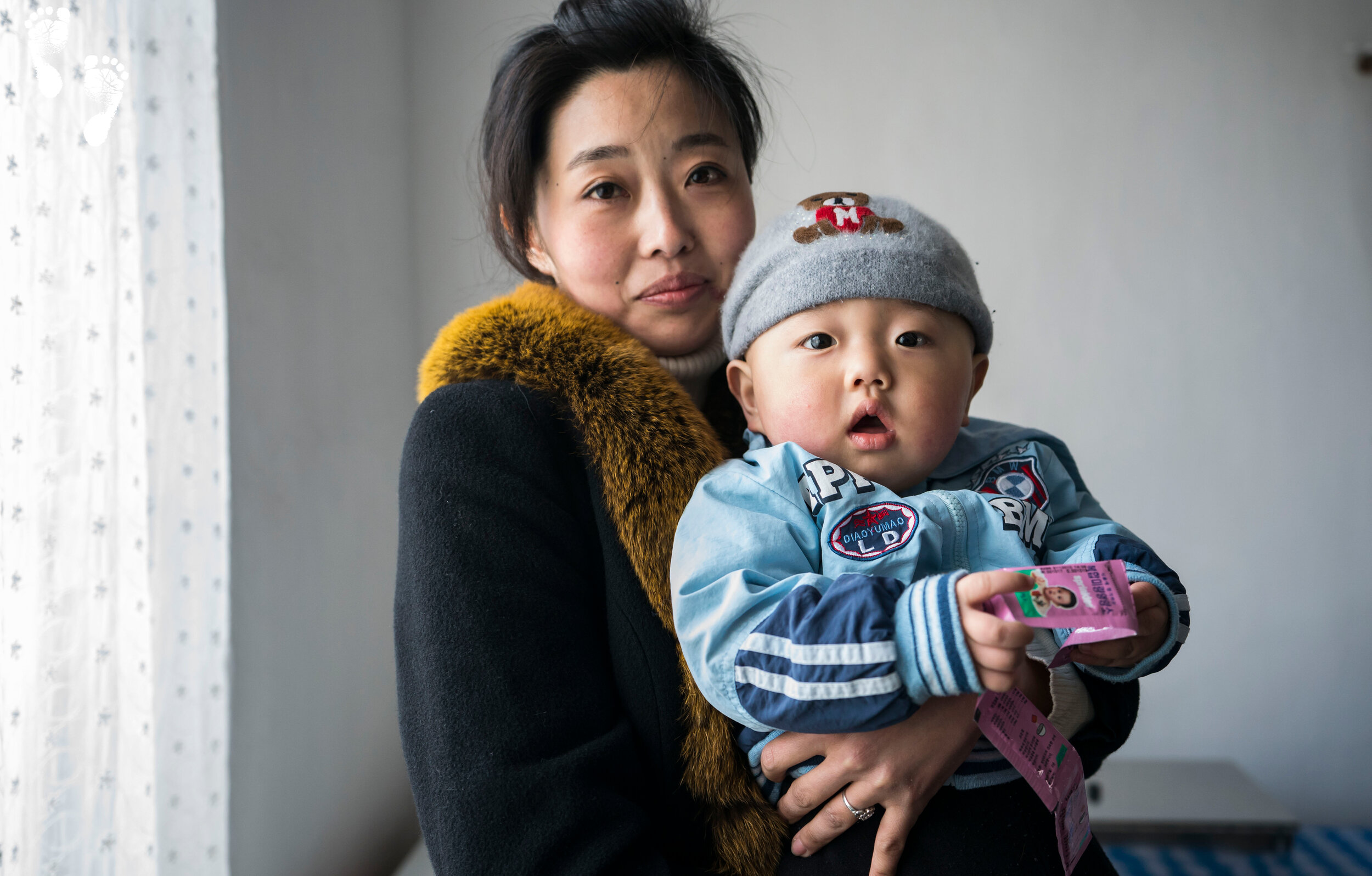 A mother and her son with Sprinkles at the Hupo Policlinic in Nampo.