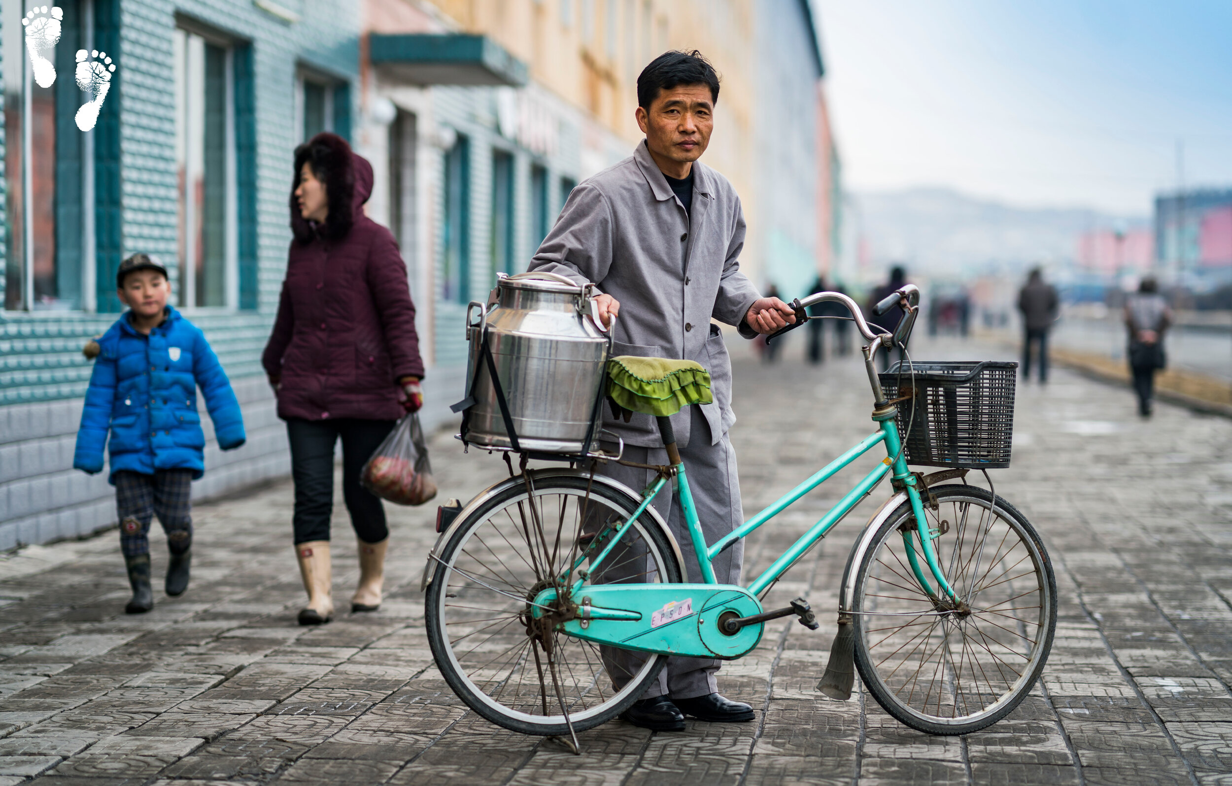 Mr. Yon with his soymilk delivery bike in front of the Hanggu Daycare and Kindergarten Supply Centre in Nampo