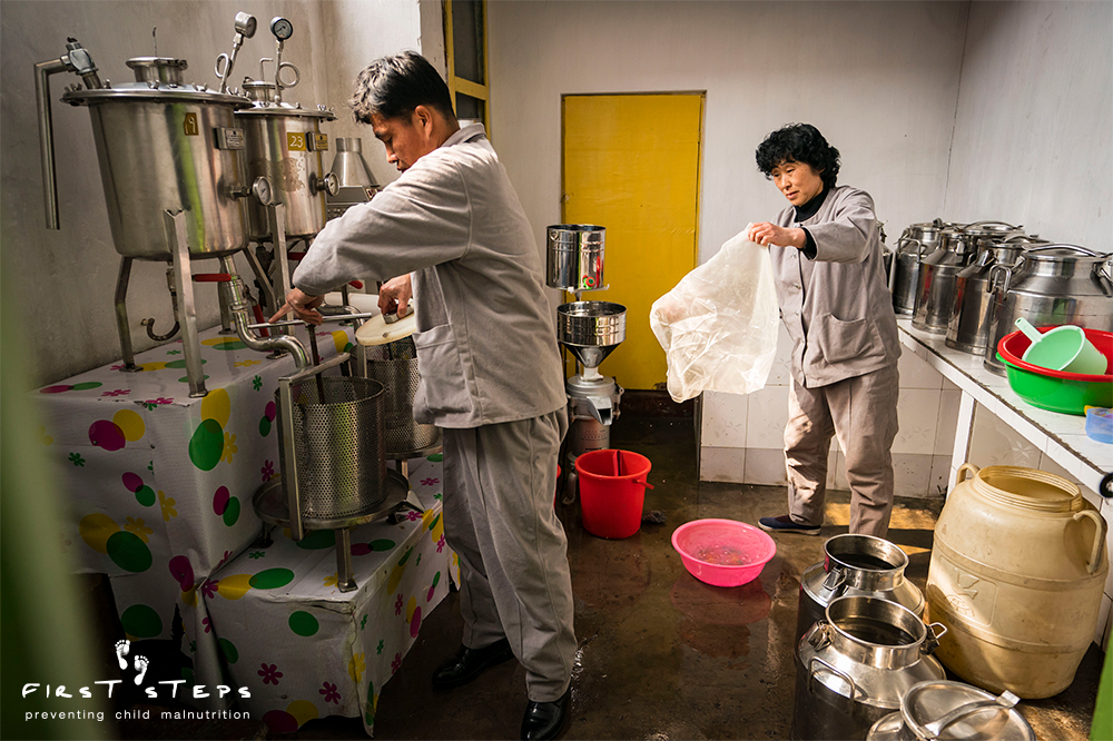 Cleaning up after finishing the day's soymilk production. 
