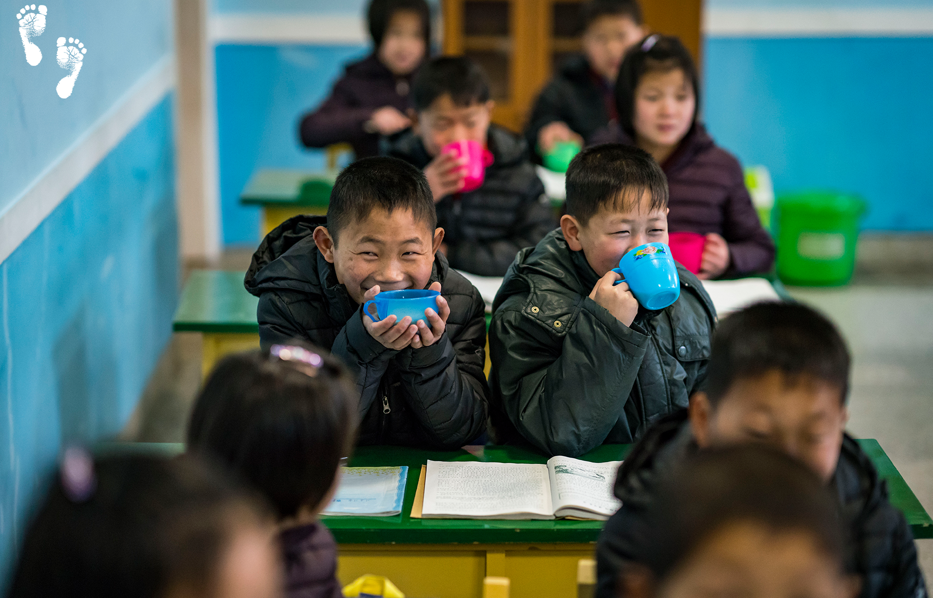 Children at the Wonsan Orphanage enjoying their morning cup of soymilk..