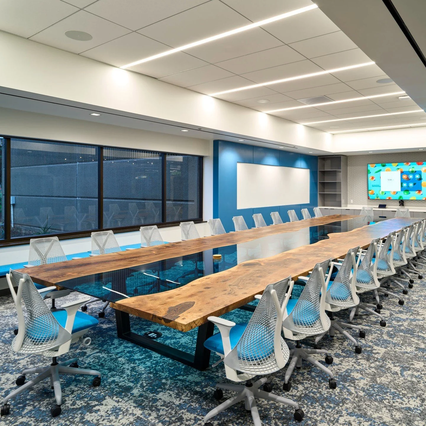 This project for @apeel_sciences featured two of the largest tables we have built to date. One of our most challenging and also personal favorites, the 32' x 9' book matched live edge walnut conference table with a glass river. But not to be outdone,