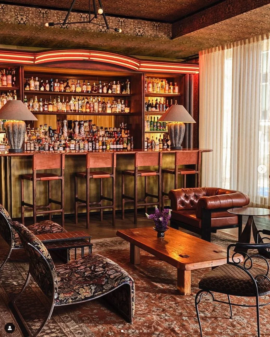 Beautiful shots of our back bar and front bar we just did at @austinproperhotel - designed by @kellywearstler Back bar done in a wire brushed cypress with copper mirrors, neon and integrated LED lighting. Front bar in burnished brass. #design #woodwo