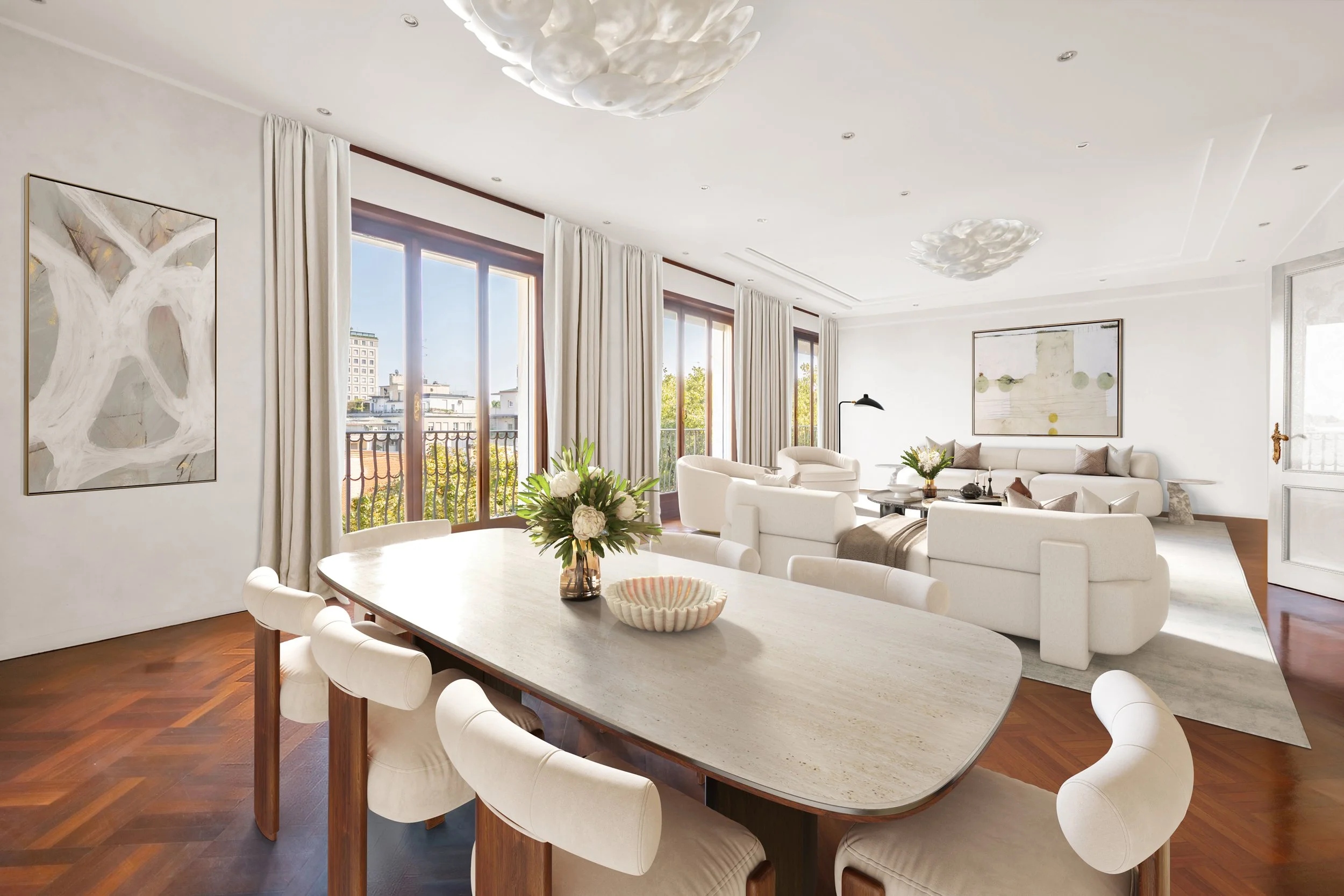 High-end home staging. Bright living and dining room with white sofas, large windows with curtains, artwork on the walls, a wooden floor, a dining table with chairs, and decorative items including flowers.