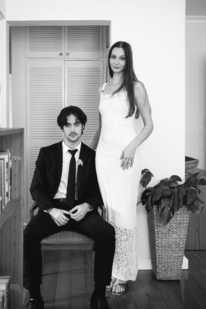 , BRIDE AND GROOM CASUALLY POSING INSIDE AN APARTMENT