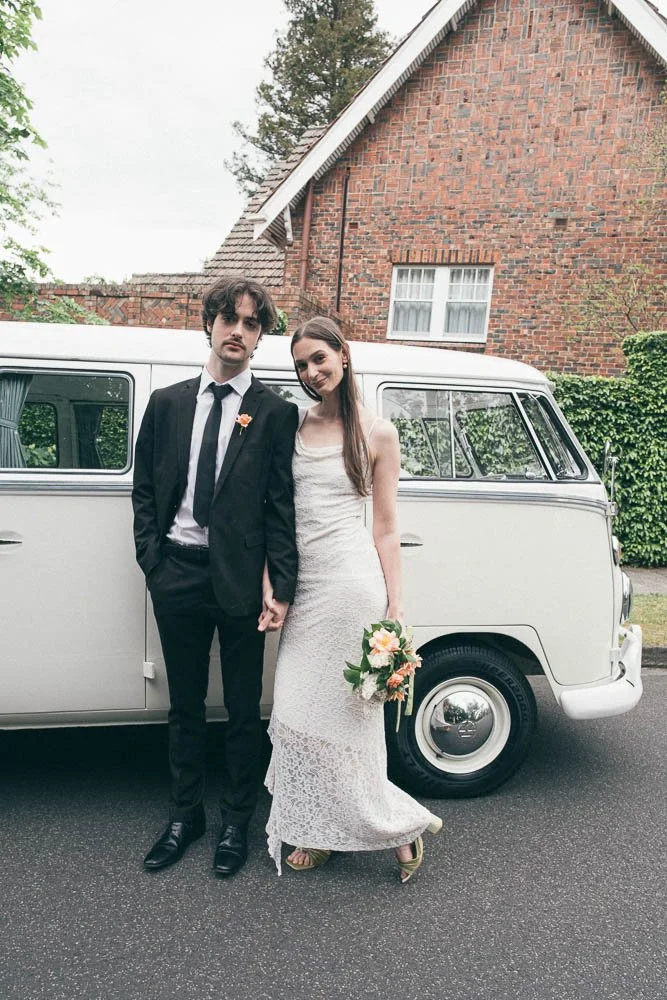 MELBOURNE  EDITORIAL WEDDING PHOTOGRAPHY, BRIDE AND GROOM POSING NEXT TO A OLD SCHOOL VW KOMBI VAN