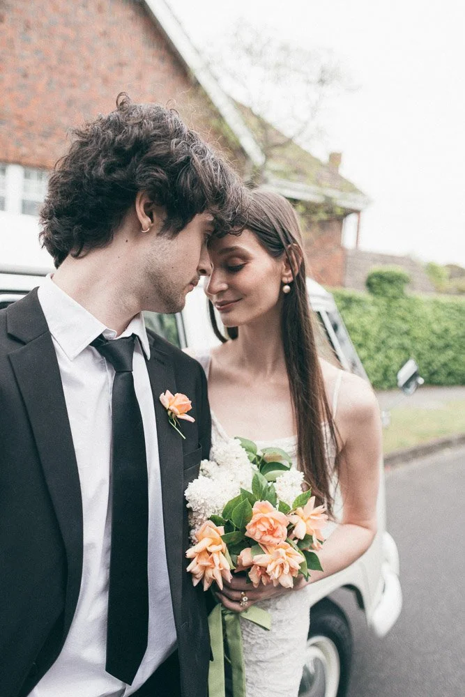 MELBOURNE  EDITORIAL WEDDING PHOTOGRAPHY, BRIDE AND GROOM POSING NEXT TO A OLD SCHOOL VW KOMBI VAN