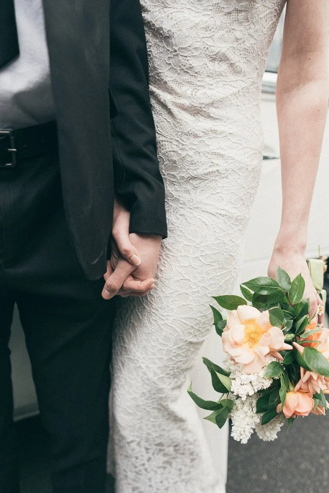 MELBOURNE  EDITORIAL WEDDING PHOTOGRAPHY, BRIDE AND GROOM POSING NEXT TO A OLD SCHOOL VW KOMBI VAN, HOLDING HANDS