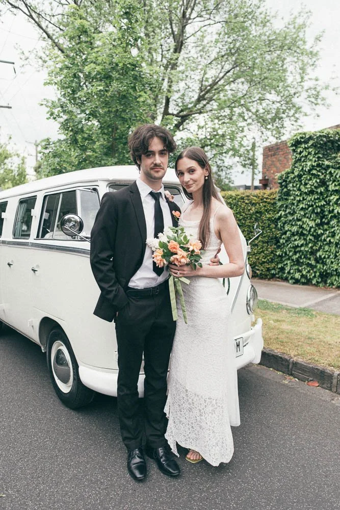 MELBOURNE  EDITORIAL WEDDING PHOTOGRAPHY, BRIDE AND GROOM POSING NEXT TO A OLD SCHOOL VW KOMBI VAN