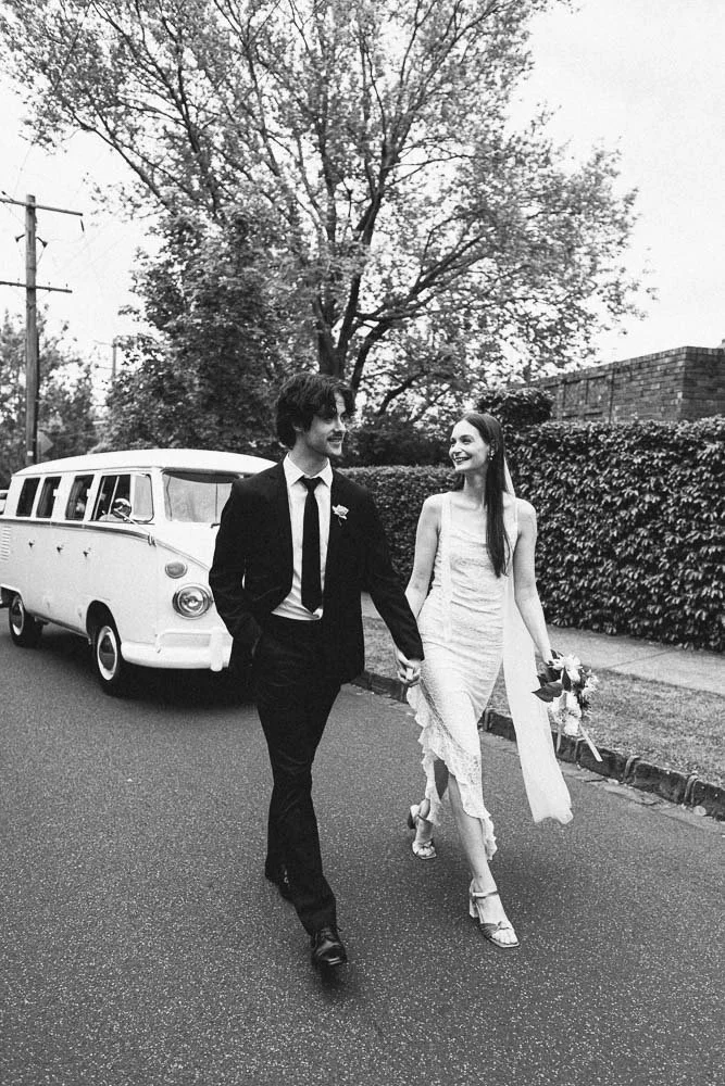MELBOURNE  EDITORIAL WEDDING PHOTOGRAPHY, BRIDE AND GROOM POSING NEXT TO A OLD SCHOOL VW KOMBI VAN, WALKING