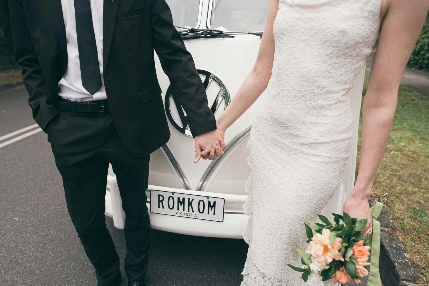 MELBOURNE  EDITORIAL WEDDING PHOTOGRAPHY, BRIDE AND GROOM POSING NEXT TO A OLD SCHOOL VW KOMBI VAN, CLOSE UP OF HANDS