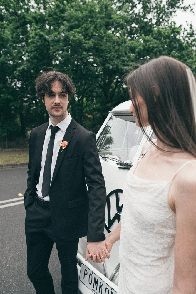 MELBOURNE  EDITORIAL WEDDING PHOTOGRAPHY, BRIDE AND GROOM POSING NEXT TO A OLD SCHOOL VW KOMBI VAN