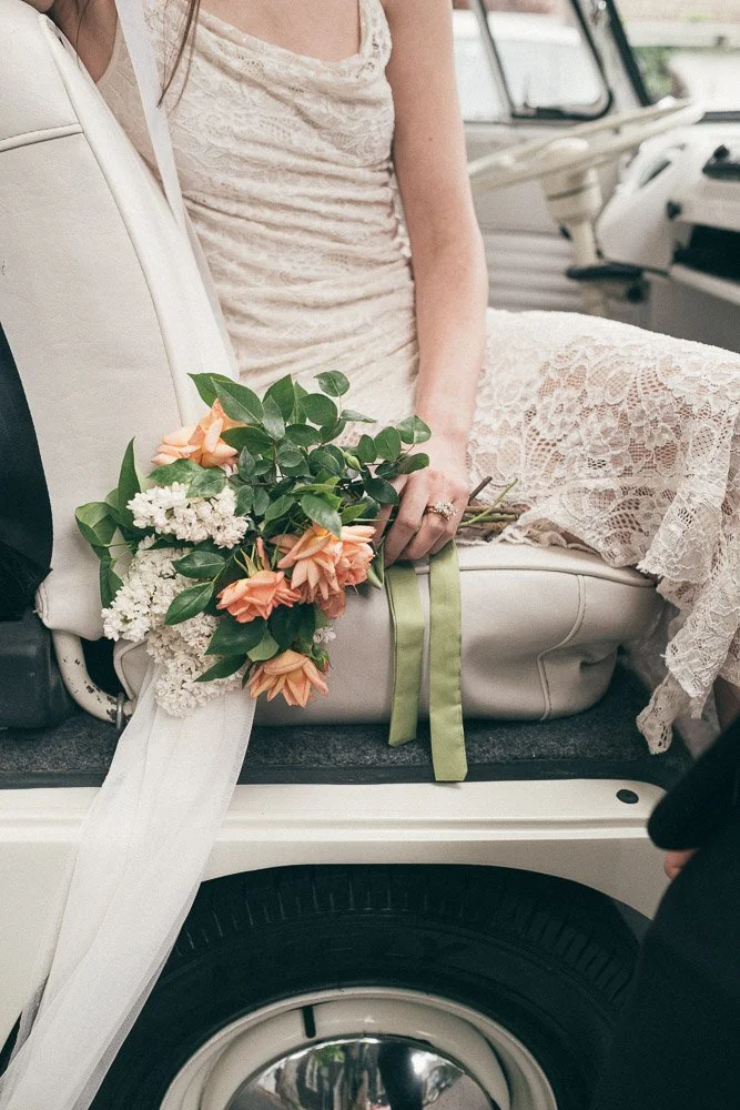 MELBOURNE  EDITORIAL WEDDING PHOTOGRAPHY, BRIDE AND GROOM POSING IN A OLD SCHOOL VW KOMBI VAN, CLOSE UP OF BRIDES FLOWERS