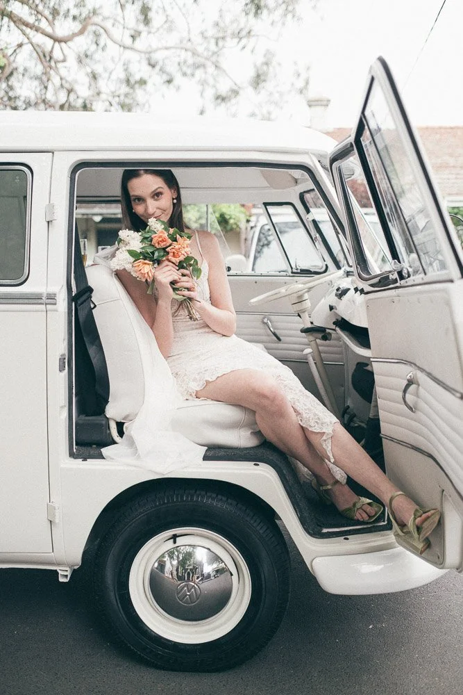MELBOURNE  EDITORIAL WEDDING PHOTOGRAPHY, BRIDE AND GROOM POSING IN A OLD SCHOOL VW KOMBI VAN