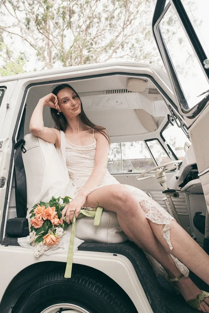 MELBOURNE  EDITORIAL WEDDING PHOTOGRAPHY, BRIDE AND GROOM POSING IN A OLD SCHOOL VW KOMBI VAN
