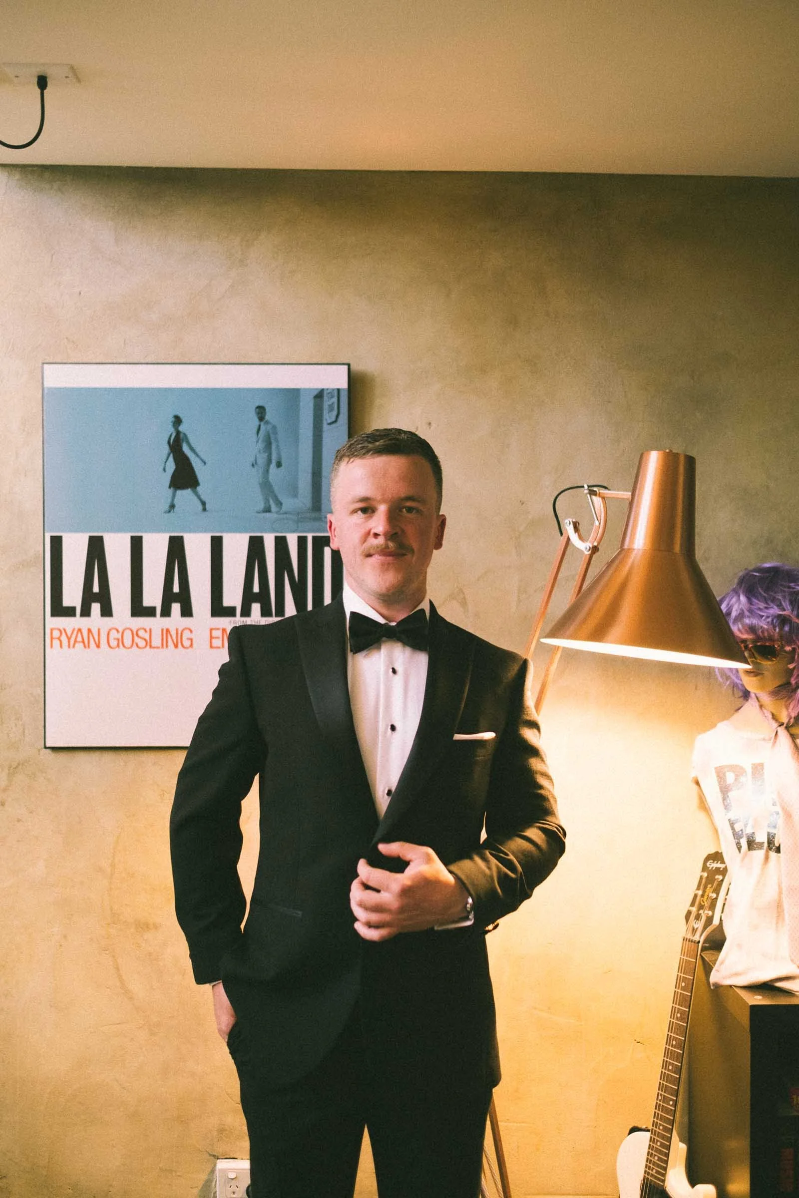 MELBOURNE BOTANICAL GARDEN WEDDING, GROOM GETTING READY, GROOMS PORTRAIT IN A BLACK SUIT