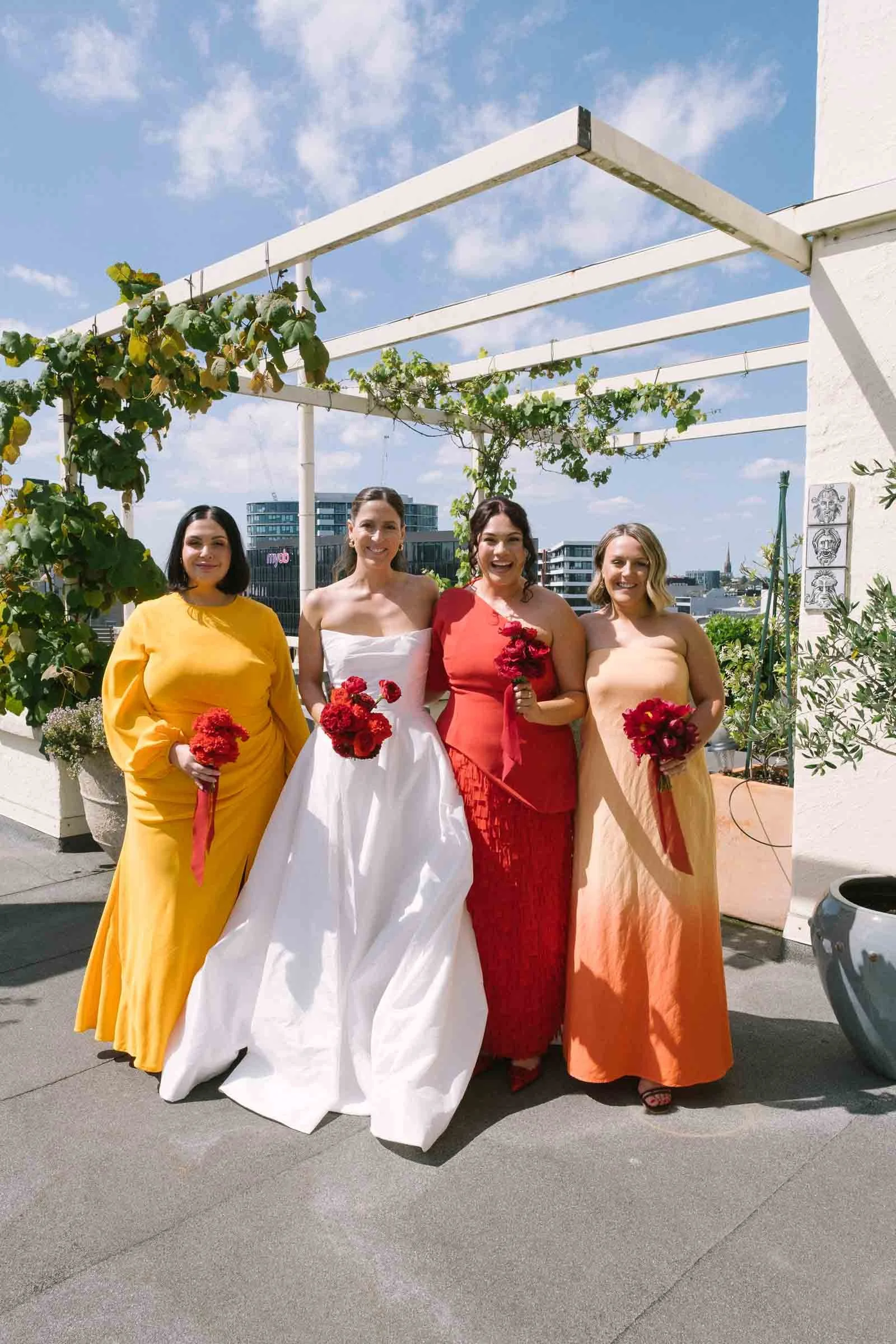 MELBOURNE BOTANICAL GARDEN WEDDING, BRIDAL PORTRAIT IN THE BALCONY UNDER BEAUTIFUL SUNLIGHT WITH HER BRIDESMAIDS