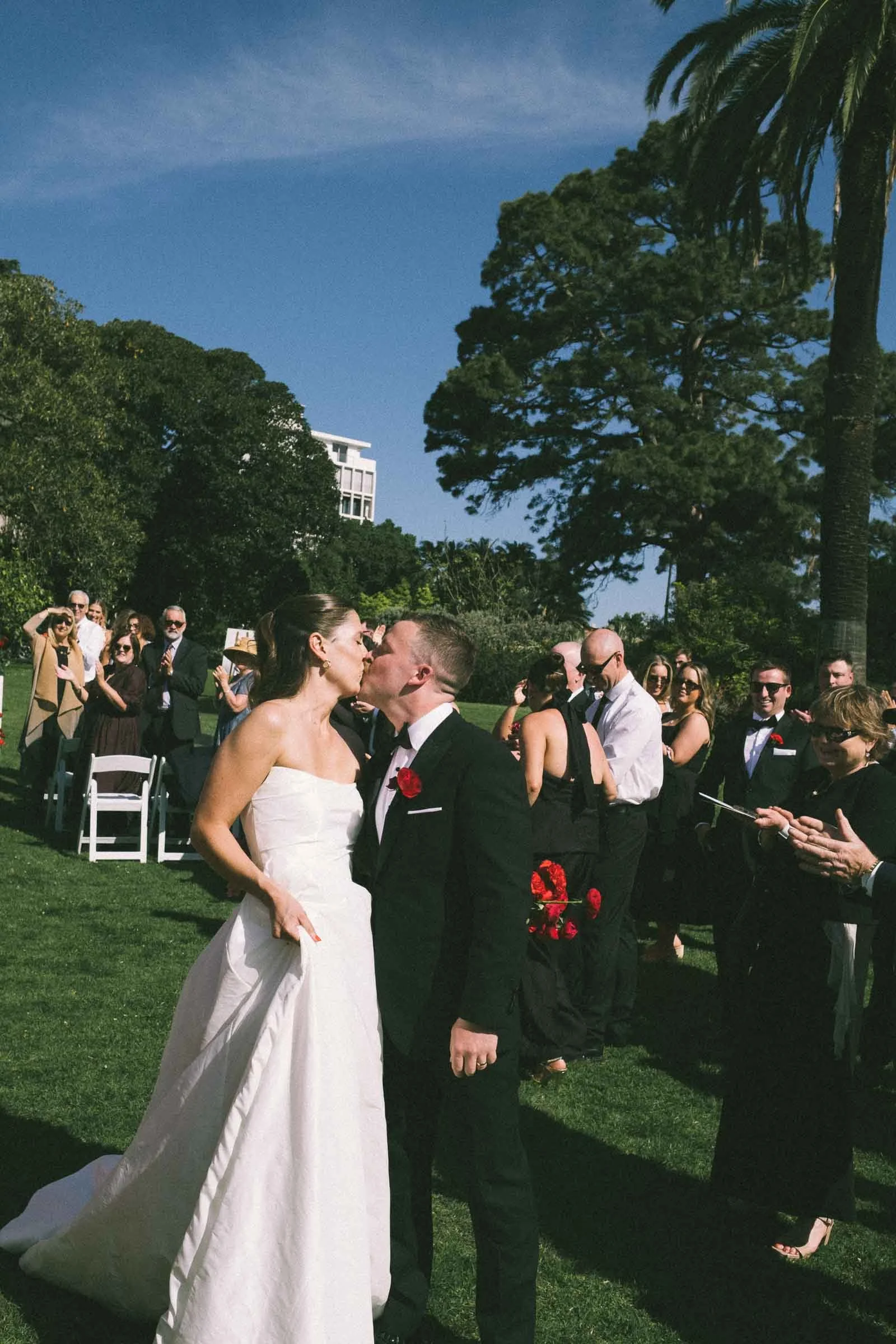 MELBOURNE BOTANICAL GARDEN WEDDING, BRIDE AND GROOM WALKING DOWN THE ISLE TOGETHER