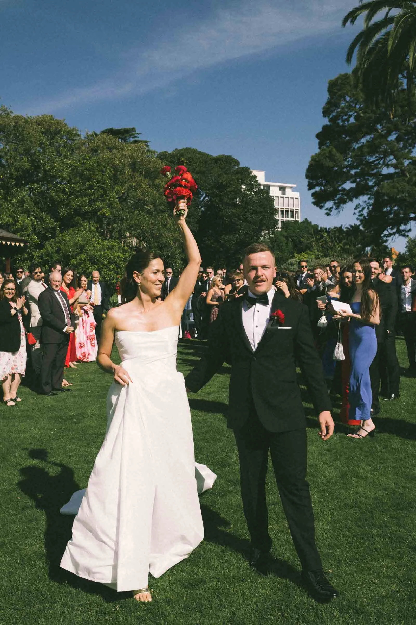 MELBOURNE BOTANICAL GARDEN WEDDING, BRIDE AND GROOM WALKING DOWN THE ISLE TOGETHER