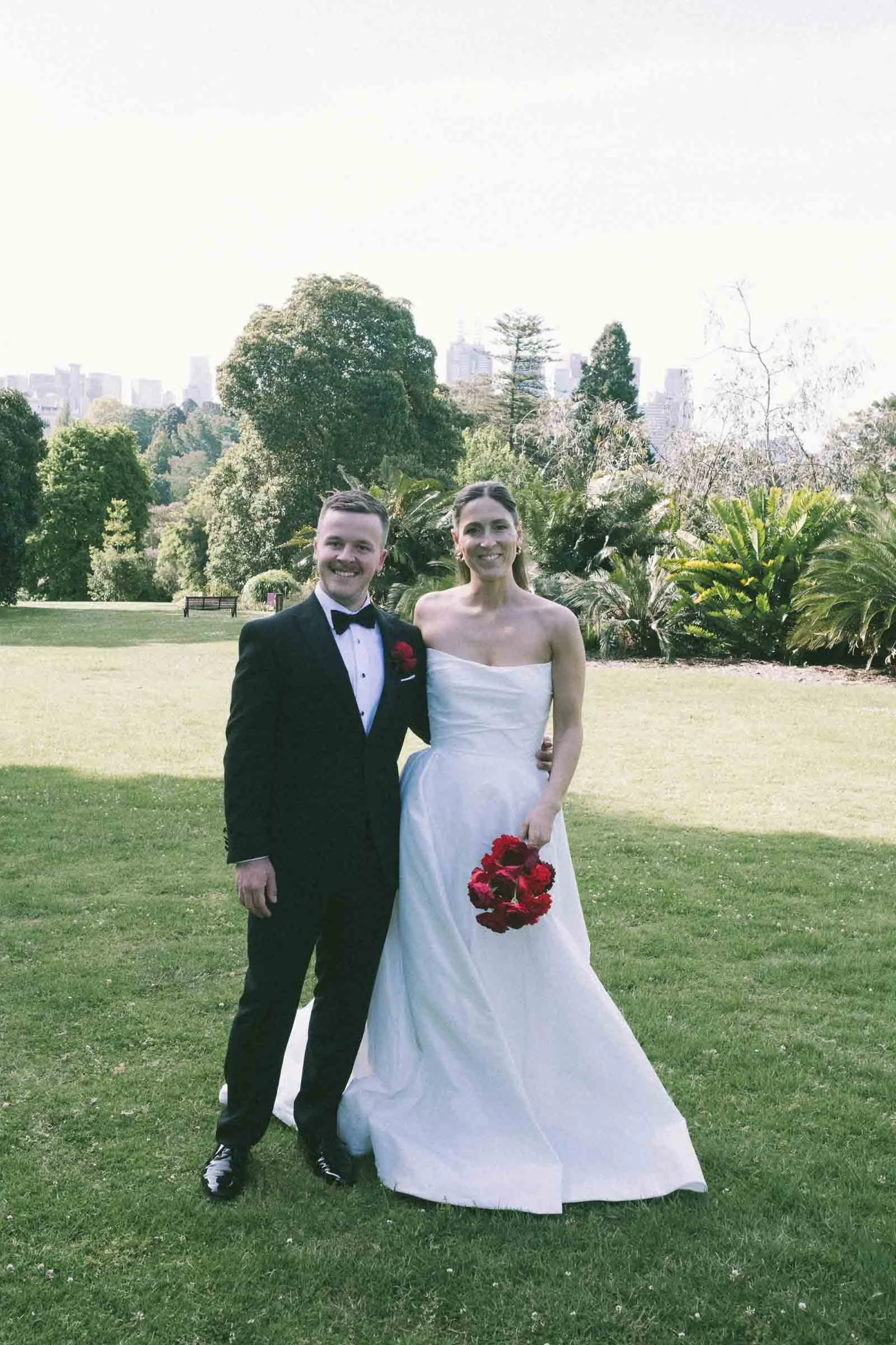 MELBOURNE BOTANICAL GARDEN WEDDING, BRIDE AND GROOM POSING ON THE GARDEN LAWNS