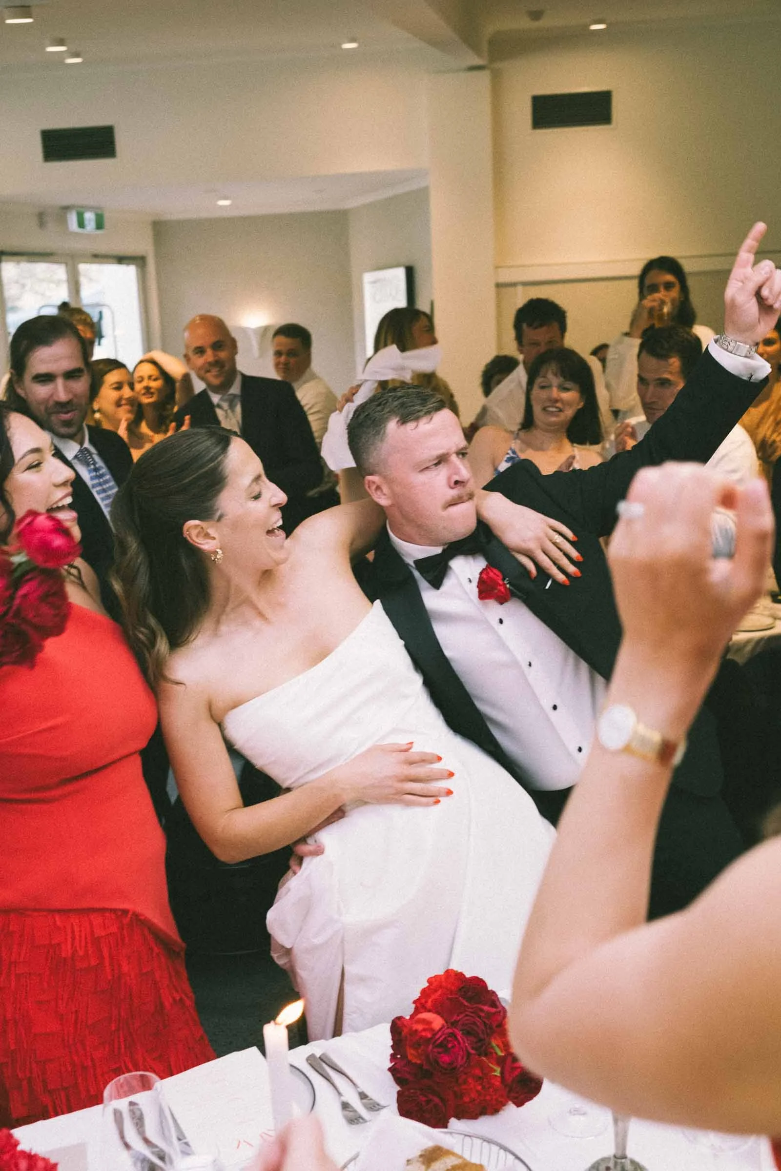 MELBOURNE BOTANICAL GARDEN WEDDING RECEPTION AT THE TERRACE, BRIDE AND GROOMS ENERGY FILLED ENTRY IN THE RECEPTION WITH GUESTS CHEERING