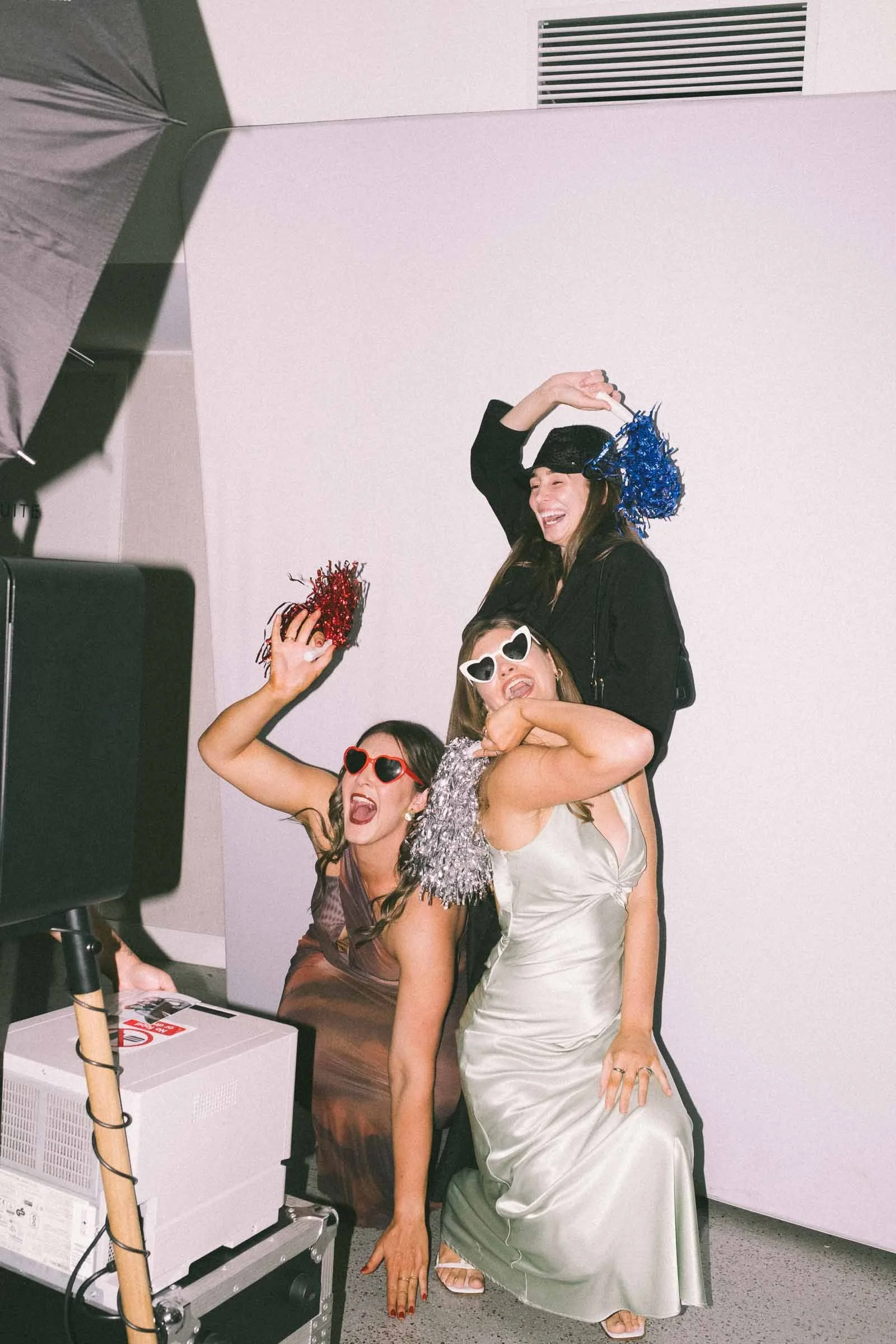 GUESTS ENJOYING THE PHOTO BOOTH