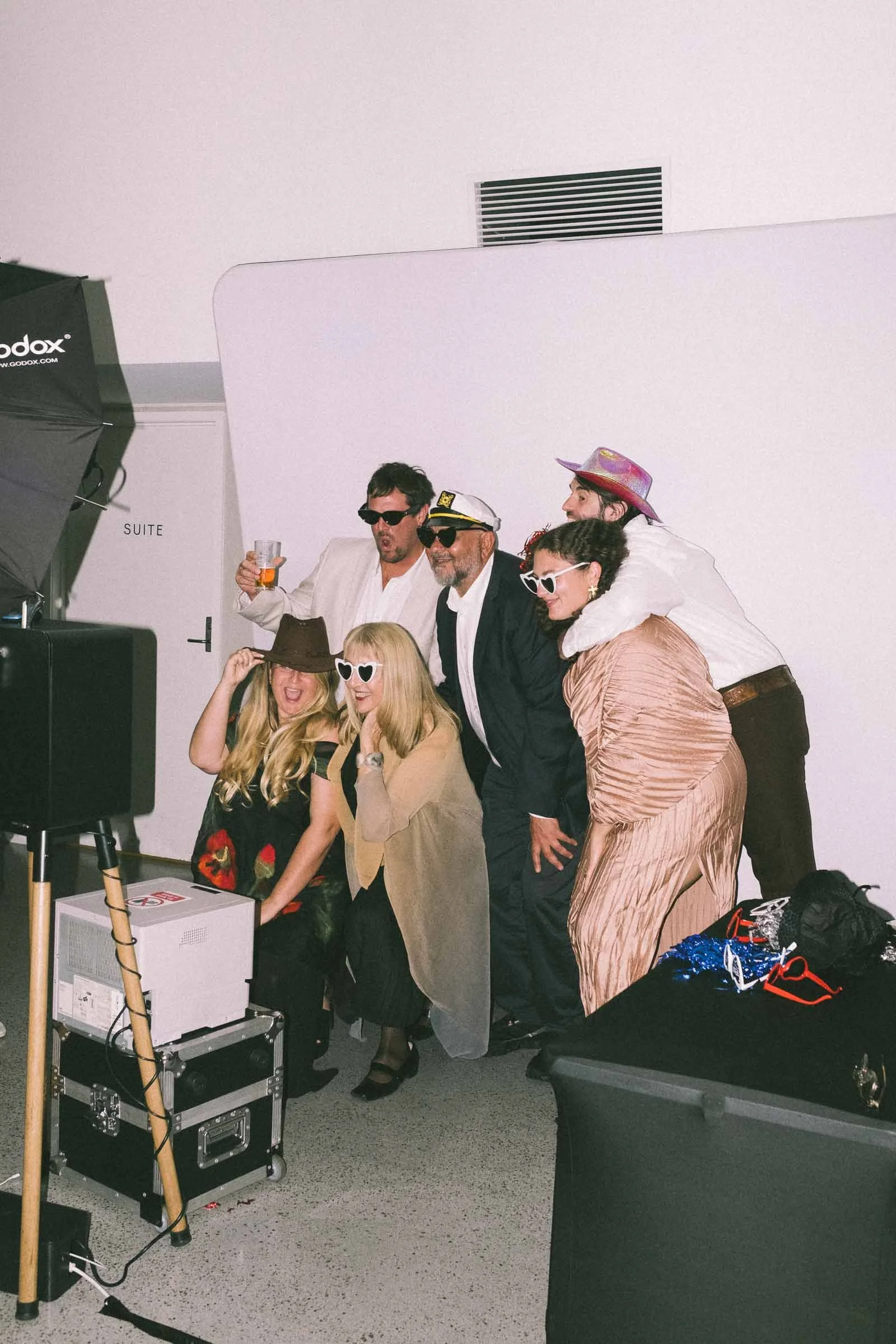 GUESTS ENJOYING THE PHOTO BOOTH