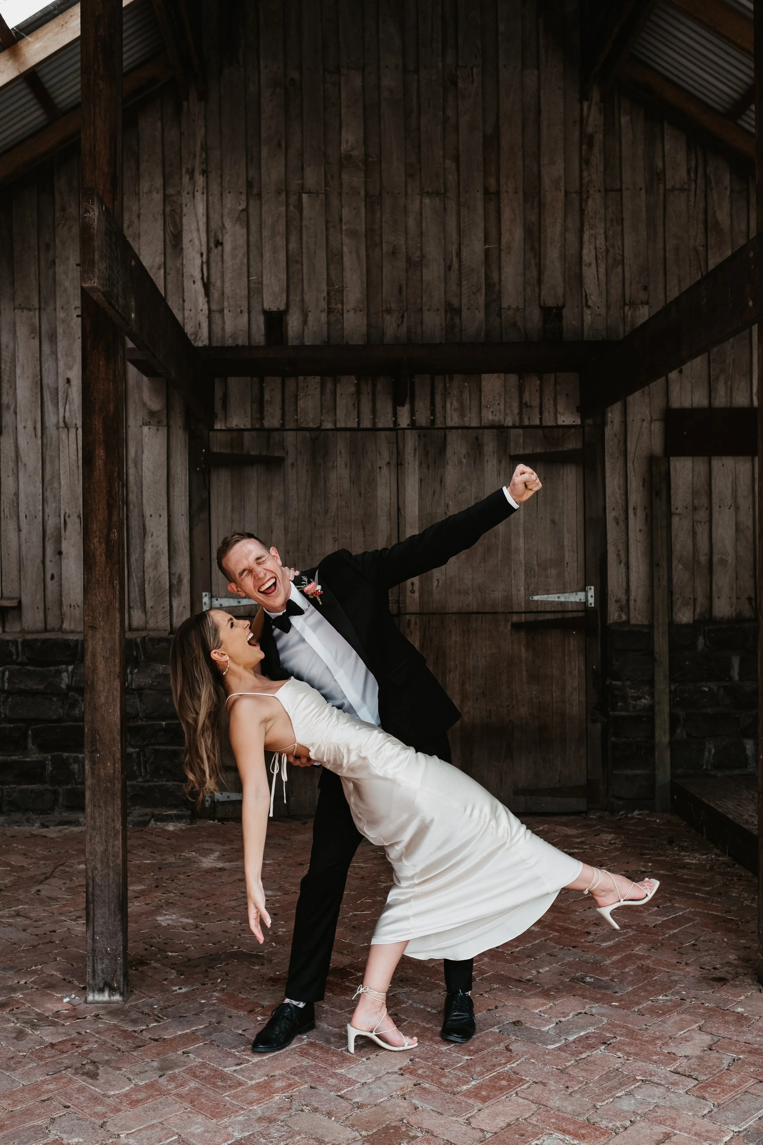 COLLINGWOOD CHILDREN FARM WEDDING OF JIM AND CHINELLE, THE COUPLE CELEBRATING IN THE BARN TOGETHER INTIMATELY