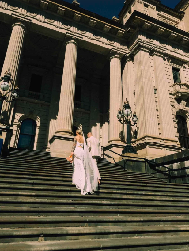 Melbourne registry wedding photography Parliament House, Couple Walking on the steps of the parliament house