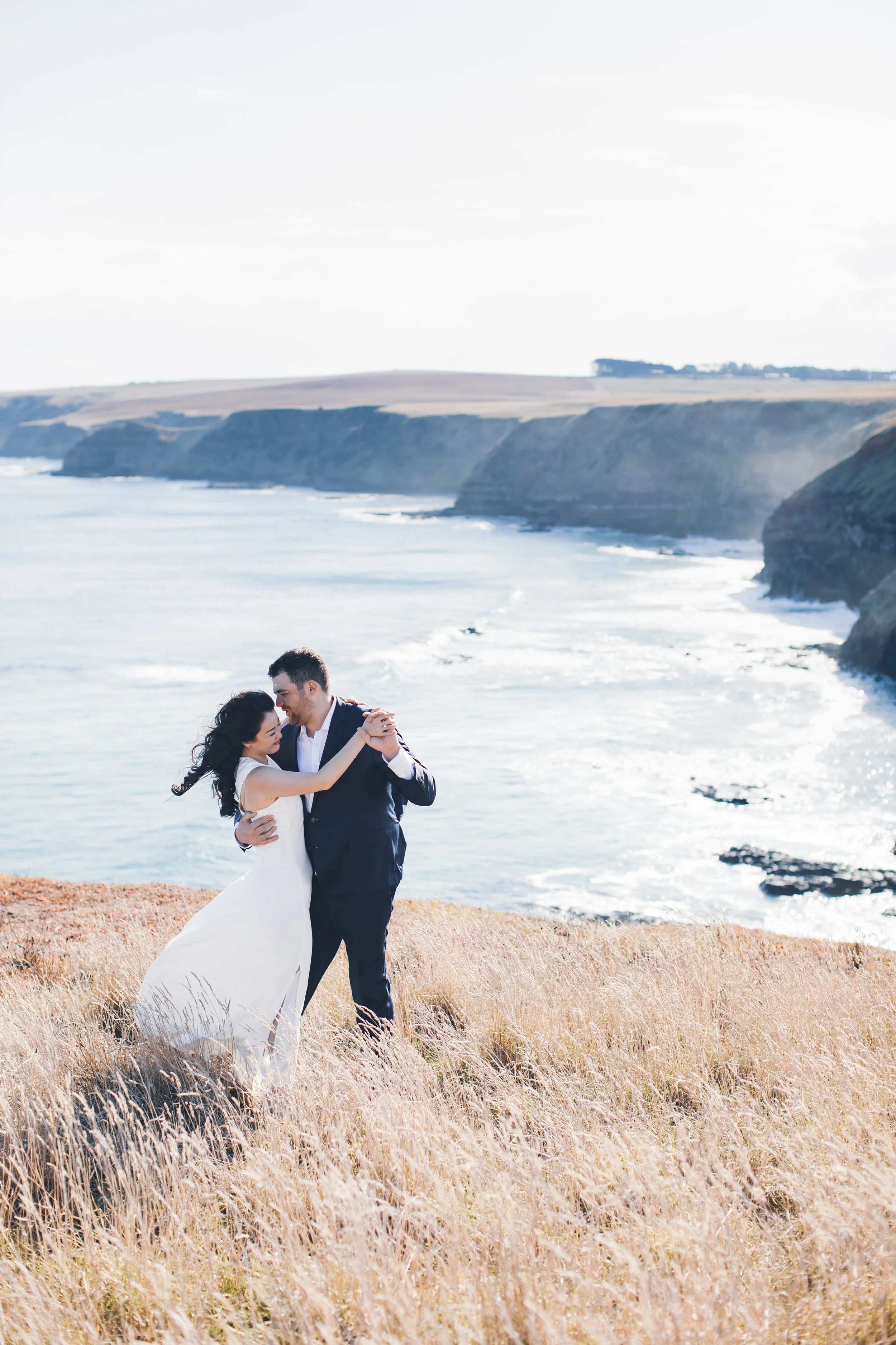 a couple dancing on the cliffs at the cairns bay in mornington peninsula