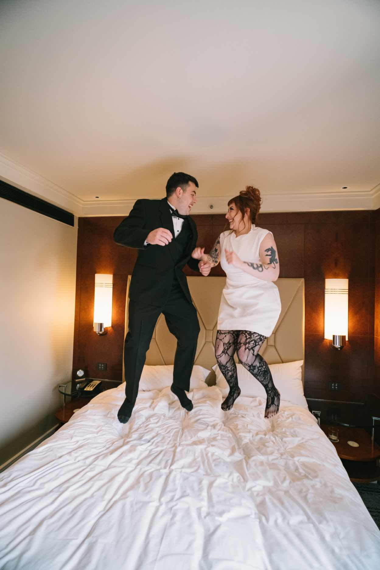 Park Hyatt Elopement | Chelsea + Jack | Couple Jumping on a bed